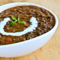 Dal Makhani · Black lentil delicately cooked with olive oil, garlic, ginger, tomatoes topped with butter, ...