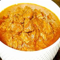 Lamb Curry · Lamb meat cooked with safflower oil, onions, ginger, garlic, potatoes, spinach, turmeric, an...