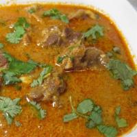 Coconut Lamb Curry · Lamb meat cooked in coconut powder, coconut milk, ginger-garlic paste, herbs, olive oil, and...