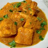 Fish Curry · Fish pieces cooked in our special tomato onion-based gravy with mustard, Indian herbs, and s...