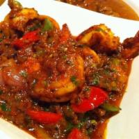 Prawn Curry · Prawns cooked in our special tomato onion-based gravy with mustard, Indian herbs, and spices.