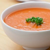 Tomato Soup · A rich creamy tomato soup spiced with basil, cumin, curry leaves and a touch of cream.
