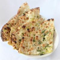Potato Naan · All-purpose flour stuffed with potato and pea creation, baked in clay pit topped with butter.