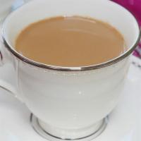 Chai Tea · An ancient tea of India, made with black tea, milk, cardamom, cloves, fennel, and sugar.