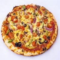 Veggie Delight Pizza · Mozzarella cheese, pizza sauce, mushrooms, onions, peppers, tomatoes, black olives, and pine...
