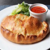 Veggie Calzone · Pizza sauce, onions, green peppers, tomatoes, black olives, and mozzarella cheese.