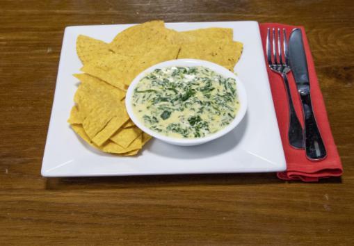 Creamed Spinach · Creamed spinach with a choice of tortilla chips or fresh bruschetta.