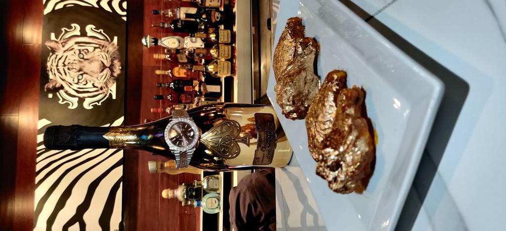 Cavali Gold Wings · Premium wings glazed in house honey mustard sauce finished with 24 Karat gold flakes.