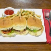 Fried Chicken Sliders · Marinated chicken breast, breaded then fried and served on mini brioche rolls finished with ...