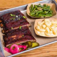 Rib Plate · St. Louis Style. Includes sauce, bread and choice of 2 sides.