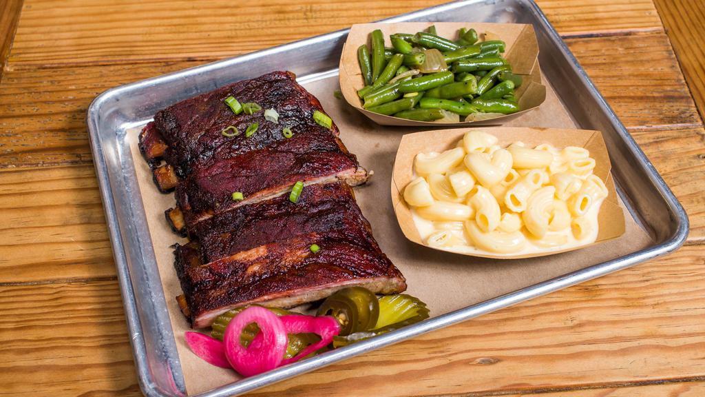 Rib Plate · St. Louis Style. Includes sauce, bread and choice of 2 sides.