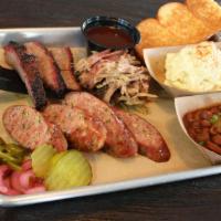 Stonehouse Trio · Sausage, Pulled Pork and Brisket. Includes sauce, bread and choice of 2 sides.