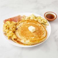 Pancakes · Served with 2 eggs an ham or bacon and home fries.