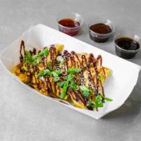 Chicken Gyoza (8pcs) · Chicken and spices, drizzled with your choice of sauce and topped with scallions and sesame ...
