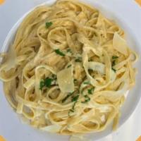 Alfredo Pasta · Fettuccine pasta, cream sauce, thyme parsley, salt and pepper, and choice of chicken or shri...