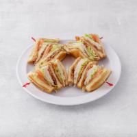 15. Club Sandwich · Turkey or ham. Cheese, bacon, lettuce and tomato.