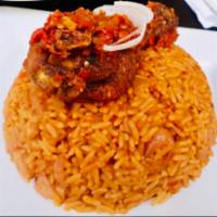 Jollof Rice Meal · Yellow rice cooked with spices (imported from Africa) and served with Grilled/Fried Tilapia ...