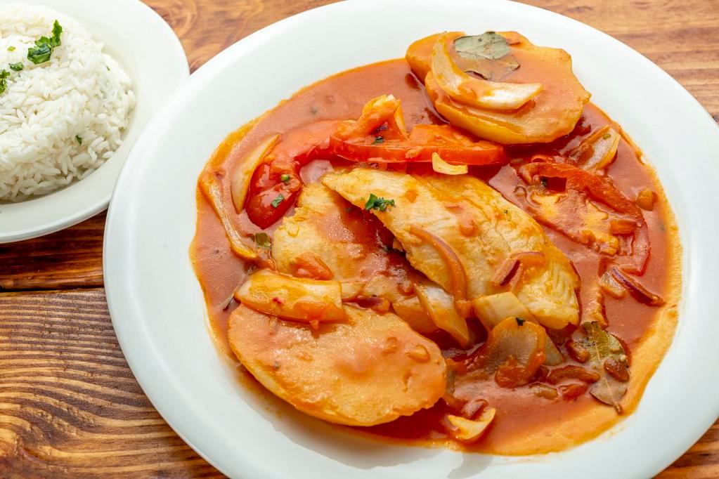 Sudado de Pescado · Stewed fish with potato and rice.