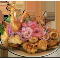 Jalea · Deep fried pieces of squid, shrimp and fish topped with hot spicy onions salad, mussels and ...