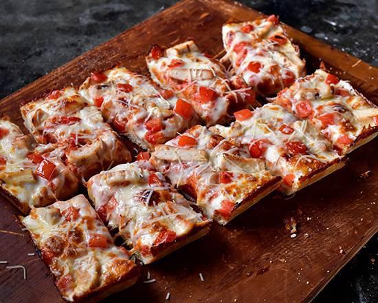 Chicken Parmesan Pizza · Pizza Sauce base, Mozzarella Cheese, Grilled Chicken Breast and tomato. Finished with a Butter Crust and Shredded Parmesan