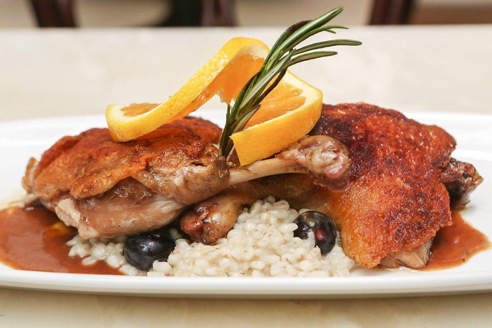 Duck  Confit 1/2 Duck · Slow-braised duck, Grand Marnier  and orange reduction served with blueberry barley risotto.