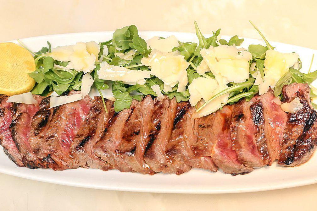 Angus Beef Strip Loin Steak · Sliced 14oz Grass Fed Angus Beef, Baby Arugula ＆ Shaved Parmesan Cheese