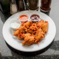 8 Piece Chicken Wings · Cooked wing of a chicken coated in sauce or seasoning.