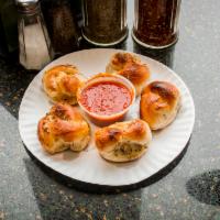 5 Garlic Knots · with marinara sauce