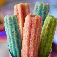 Unicorn Churros · Our churros just became magical! They are baked to perfection, and dusted with cotton candy,...