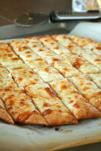 Cheese Breadsticks · Served with sauce.