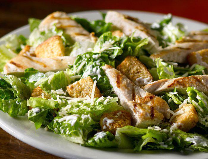 Chicken Caesar Salad · Chicken, romaine lettuce, parmesan and croutons.