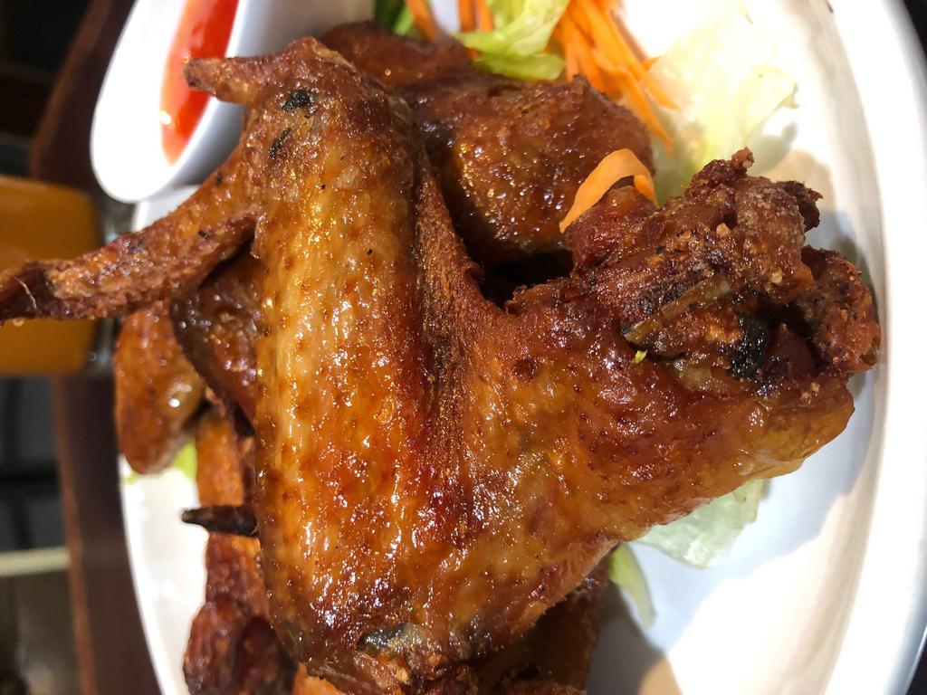 Peek Gai Tod (Chicken Wings) · Fried marinated chicken wings with sweet chili sauce.