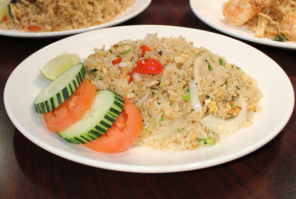 Kao Pad (Fried Rice) · Stir fried rice, egg, garlic, scallion, fresh cucumber and fresh tomato.