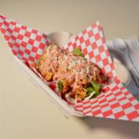 Toston Monta’o · Gluten-free. Large toston fried plantain topped with lettuce, ground beef or shredded chicke...