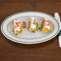 3 Mini Empanadas · Filled with chorizo, potatoes, and cheese, finished with sour cream, pico de gallo and guaca...