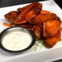 Buffalo Wings · Served with celery, carrots and blue cheese.