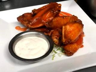 Buffalo Wings · Served with celery, carrots and blue cheese.