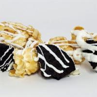 Cookies N' Cream · Caramel popcorn and chunks of chocolate cookies pieces drizzled with white chocolate for thi...