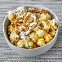 White Chocolate Pretzel Popcorn · Caramel popcorn and salty, crunchy pretzels drenched in white chocolate make this a delectab...