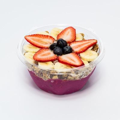 Hawaiian Bowl · Organic pitaya, pomegranate juice, strawberries and bananas. Topped with granola, coconut, honey, bananas and strawberries.