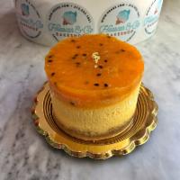 Passion Fruit Cheesecake · Exquisite passion fruit cheesecake with a graham cracker crust and topped with passion fruit...
