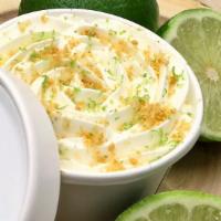 Key Lime Pie · Graham cracker crust, fresh key lime custard, and whipped cream topped with lime zest and gr...