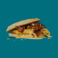 Bacon, Egg and Cheese Sandwich · 3 strips of bacon, scrambled eggs and American cheese on a toasted English muffin. Served Al...