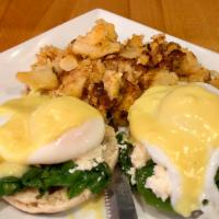 Florentine Benedict · 2 poached eggs, spinach, feta cheese and Hollandaise sauce on English muffin. Served with ho...