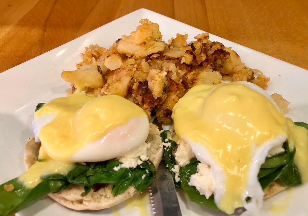 Florentine Benedict · 2 poached eggs, spinach, feta cheese and Hollandaise sauce on English muffin. Served with home fries.