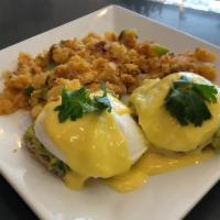 Guacamole Benedict · 2 poached eggs, guacamole and Hollandaise sauce on multi-grain English muffin served with ho...
