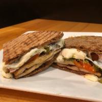 Chicken Pesto Panini · Grilled chicken, roasted peppers, pesto sauce  and low fat fresh mozzarella on a whole wheat...