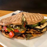 Flamed Chicken Pesto Panini · Grilled chicken, roasted eggplant, zucchini, peppers, goat cheese, pesto sauce on a  whole w...