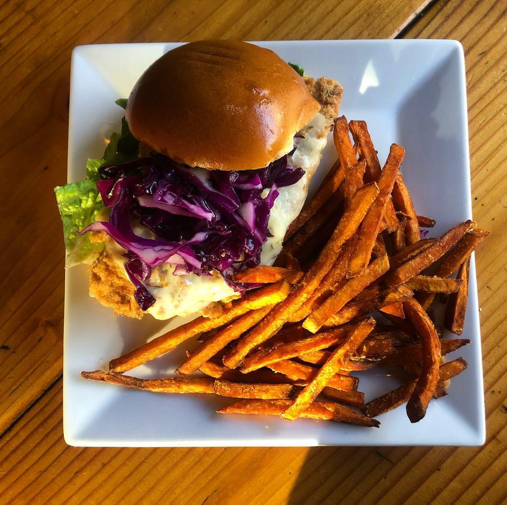 Buttermilk-Chicken Sandwich · Crispy buttermilk chicken, Pepper jack cheese, purple cabbage, lettuce, tomato, pickles, chipotle mayo on brioche bun