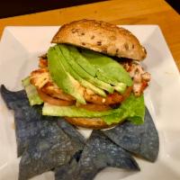 Fresh Grilled Salmon Burger · served with avocado, leaf of romaine lettuce, tomato and chipotle mayo on multigrain roll